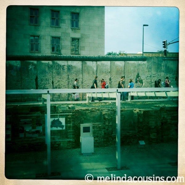 Some of the outdoor Topography of Terror's exhibits in front of a section of the Berlin Wall