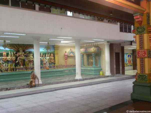 Hindu priest relaxing at the Sri Mamamarianmanan temple